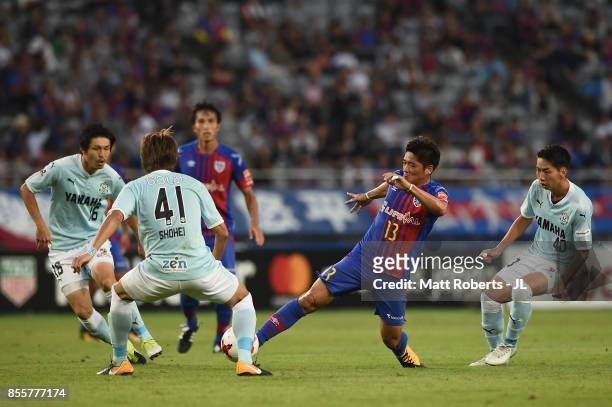 Yoshito Okubo of FC Tokyo controls the ball under pressure of Jubilo Iwata defense during the J.League J1 match between FC Tokyo and Jubilo Iwata at...