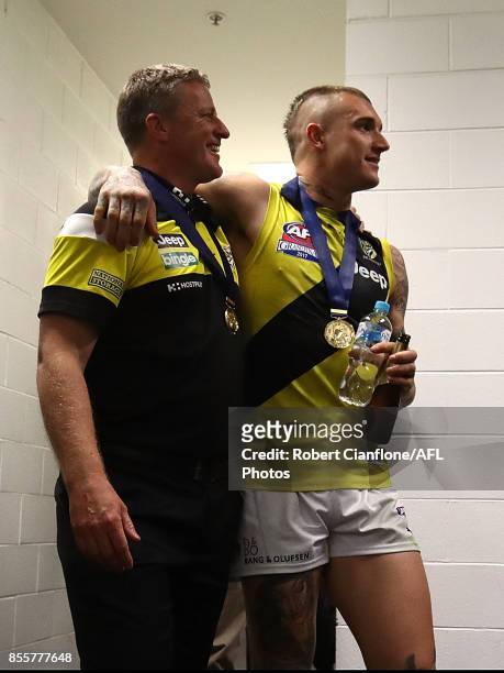 Tigers coach Damien Hardwick and Dustin Martin arrive for a press conference after the Tigers defeated the Crows at the 2017 AFL Grand Final match...
