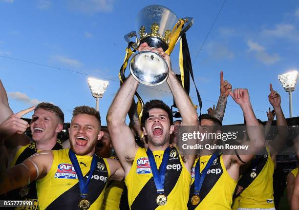 Trent Cotchin of the Tigers holds up the Premiership Trophy after winning the 2017 AFL Grand Final match between the Adelaide Crows and the Richmond...