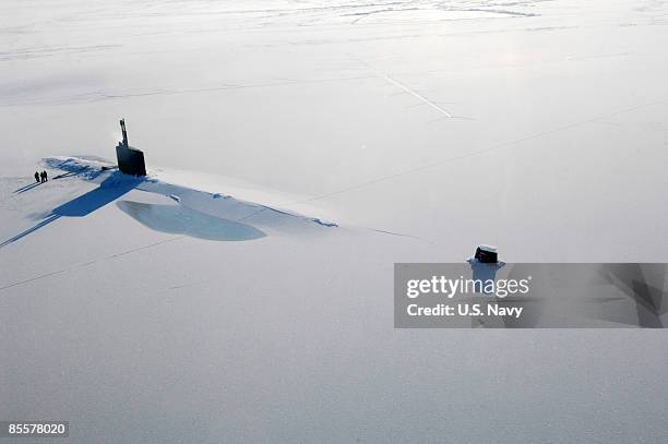 In this handout image provided by the U.S. Navy, The Los Angeles-class submarine USS Annapolis rests on the Arctic Ocean after breaking through three...