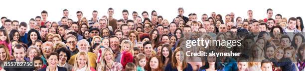 large group of happy people isolated on white looking at camera. - large group of people all ages stock pictures, royalty-free photos & images