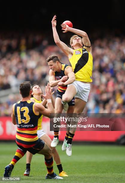 David Astbury of the Tigers is challenged by Rory Atkins of the Crows during the 2017 AFL Grand Final match between the Adelaide Crows and the...