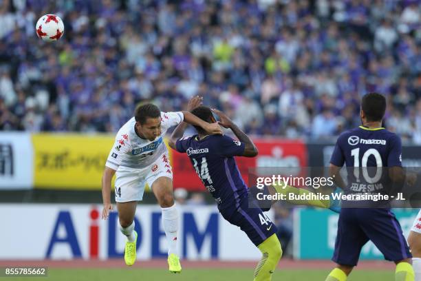 Akito Fukumori of Consadole Sapporo and Anderson Lopes of Sanfrecce Hiroshima compete for the ball during the J.League J1 match between Sanfrecce...