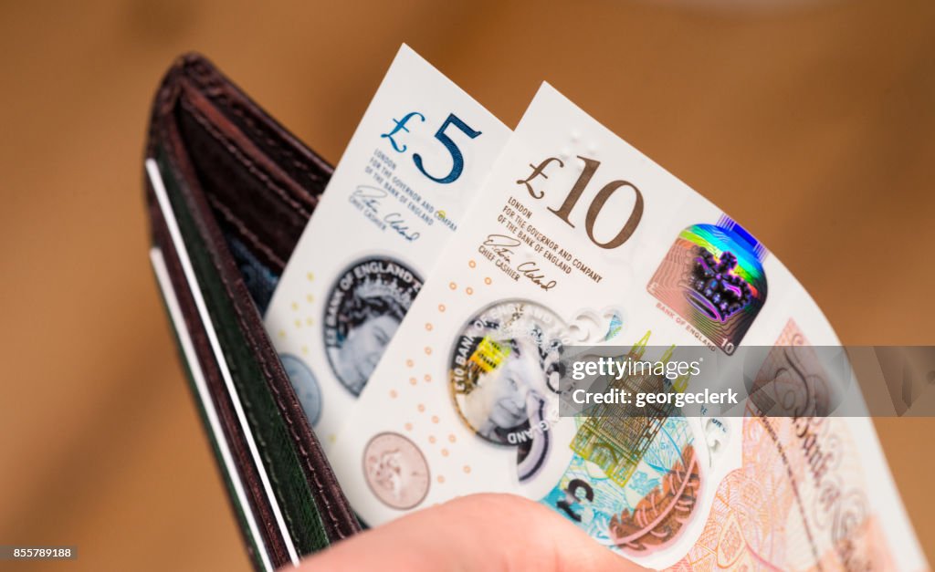 New British ten pound and five pound polymer notes in a wallet