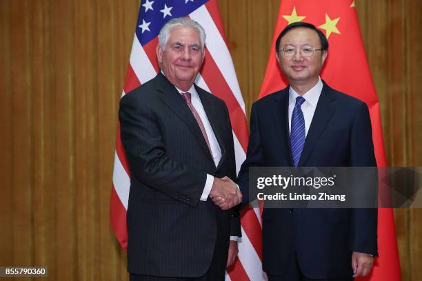 Secretary of State Rex Tillerson shakes hands with Chinese State Councilor Yang Jiechi before their meeting at the Great Hall of the People on...