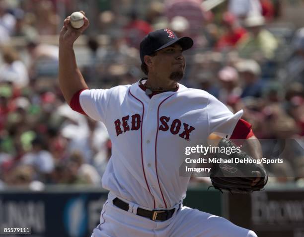 Pitcher Josh Beckett of the Boston Red Sox pitches during a spring training game against the Philadelphia Phillies at City of Palms Park on March 22,...