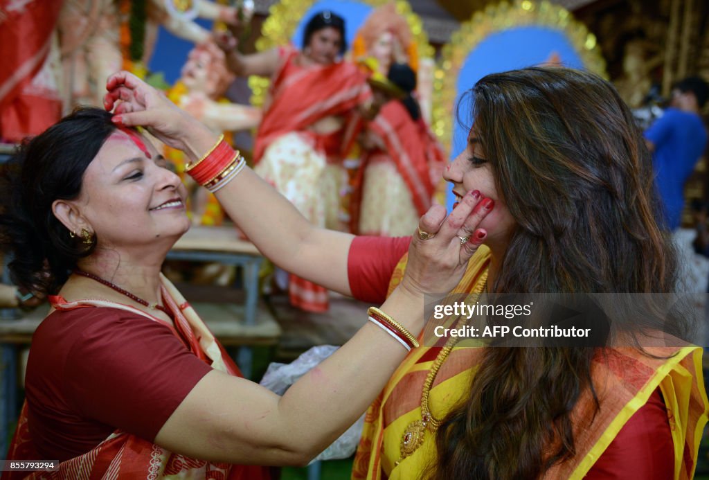 Vermilion Powder Indian Hindu devotees apply vermilion powder to each other's faces ...