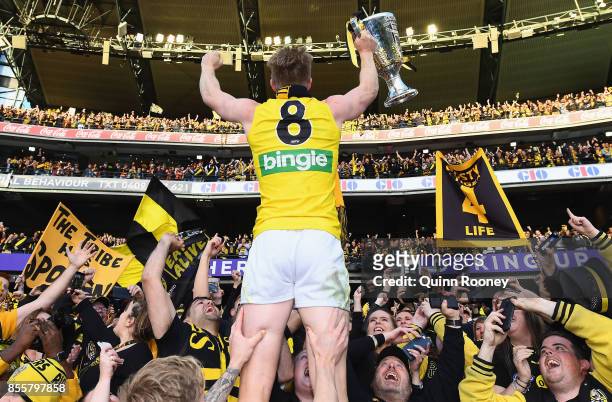 Jack Riewoldt of the Tigers celebrates with the Premiership Trophy after winning the 2017 AFL Grand Final match between the Adelaide Crows and the...