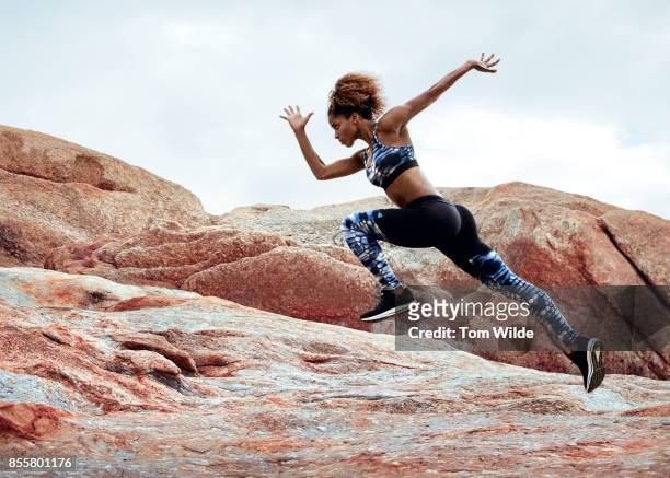 female athlete running in nature - sportswear stock pictures, royalty-free photos & images