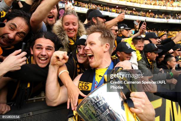 Jack Riewoldt of the Tigers celebrates with fans after winning the 2017 AFL Grand Final match between the Adelaide Crows and the Richmond Tigers at...