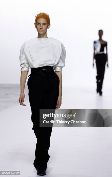 Model walks the runway during the Haider Ackermann show as part of the Paris Fashion Week Womenswear Spring/Summer 2018 on September 30, 2017 in...