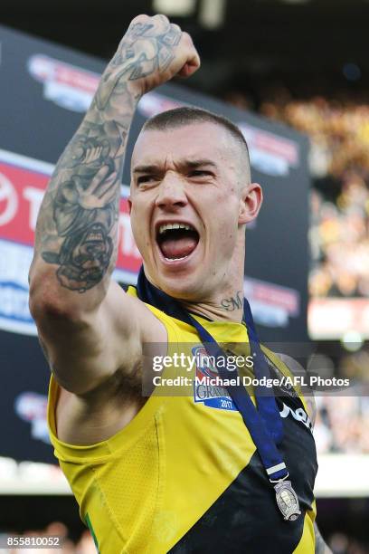 Dustin Martin of the Tigers celebrates after receiving the Norm Smith Medal during the 2017 AFL Grand Final match between the Adelaide Crows and the...