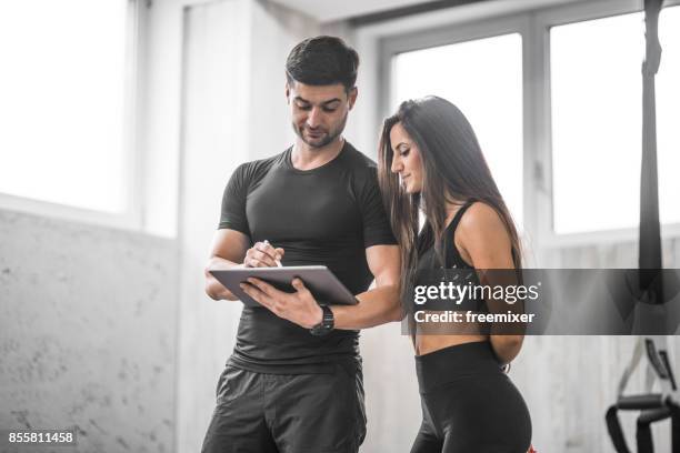 este es nuestro trabajo plan - instructor de acondicionamiento físico fotografías e imágenes de stock