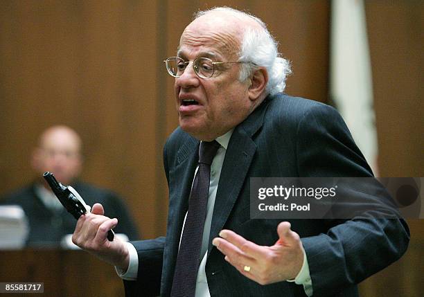 Defense attorney Doron Weinberg talks about forensic evidence on the gun during closing arguments in the retrial murder case of music producer Phil...