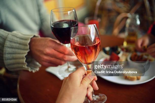 couple tasting rose and red wine from personal perspective