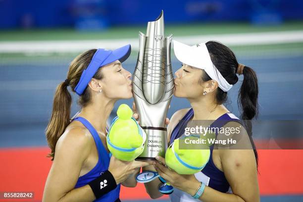 Martina Hingis of Switzerland and Yung Jan Chan of Chinese Taipei celebrate with the trophy following their victory during the Ladies Doubles final...