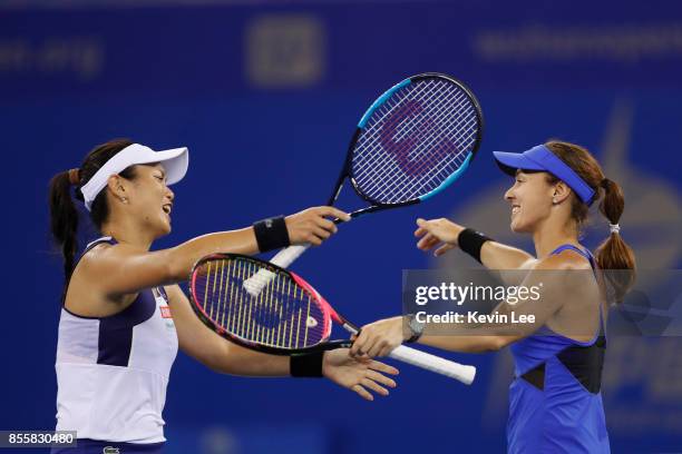 Yung-Jan Chan of Chinese Taipei and Martina Hingis of Switzerland celebrate their victory during the Ladies Doubles final against Shuko Aoyama of...