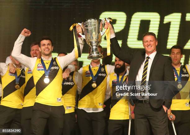 Trent Cotchin and the Tigers and Damien Hardwick, coach of the Tigers celebrate with the AFL Premiership Cup during the Richmond Tigers AFL Grand...