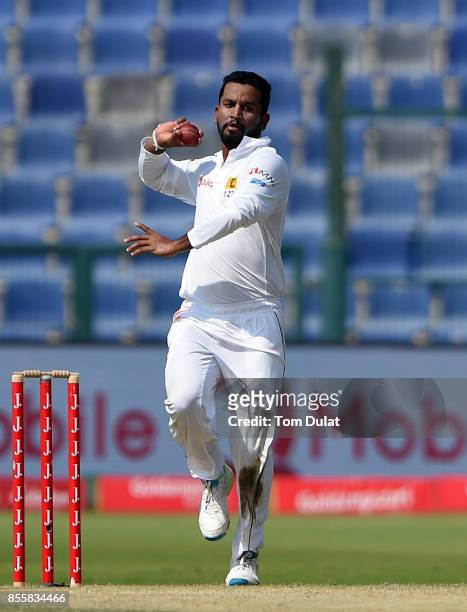Dimuth Karunaratne of Sri Lanka bowls during Day Three of the First Test between Pakistan and Sri Lanka at Sheikh Zayed Stadium on September 30, 2017...