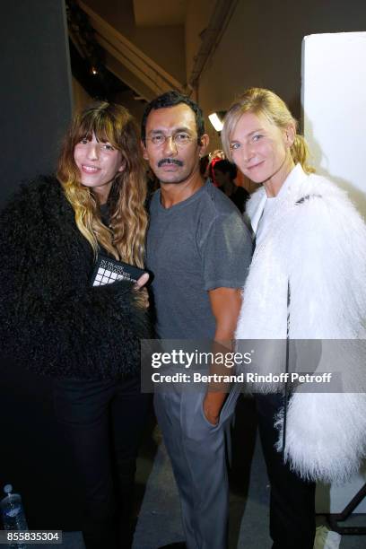 Stylist Haider Ackermann standing between Elizabeth von Guttman and Lou Doillon , both dressed in Haider Ackermann, pose Backstage after the Haider...