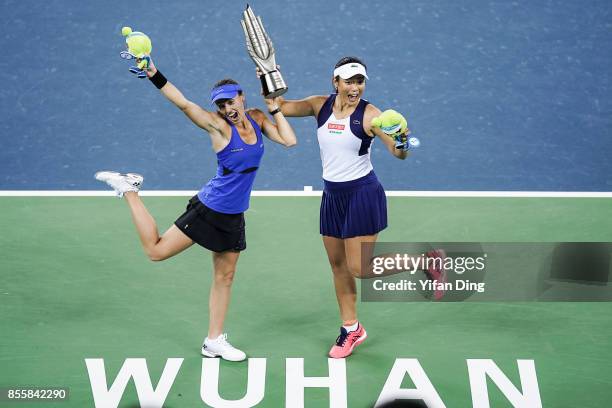 Martina Hingis and Yung-Jan Chan hold the champion trophy at the award ceremony after wnning the ladies doubles final between Martina Hingis of...