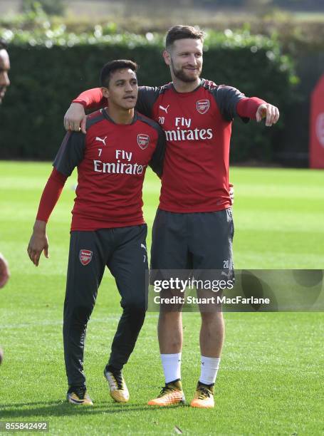 Alexis Sanchrez and Shkodran Mustafi of Arsenal during a training session at London Colney on September 30, 2017 in St Albans, England.