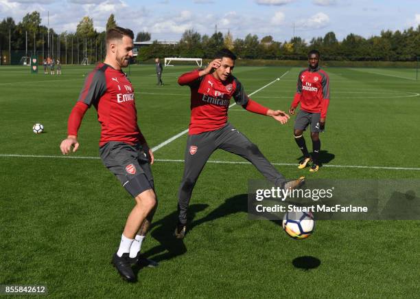 Aaron Ramsey and Alexis Sanchez of Arsenal during a training session at London Colney on September 30, 2017 in St Albans, England.