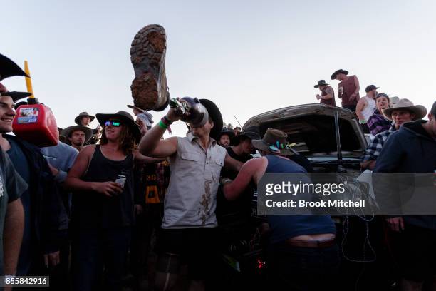 Man is seen drinking beer from his artificial leg on the wild last night of the 2017 Deni Ute Muster on September 30, 2017 in Deniliquin, Australia....