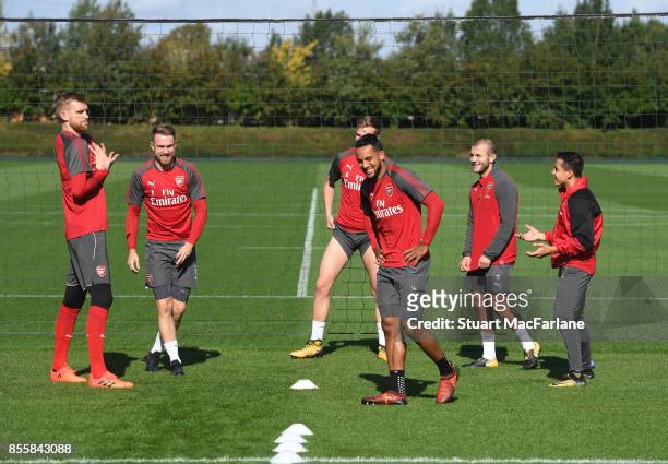 Per Mertesacker, Aaron Ramsey, Theo Walcott, Jack Wilshere and Alexis Sanchez of Arsenal during a training session at London Colney on September 30,...