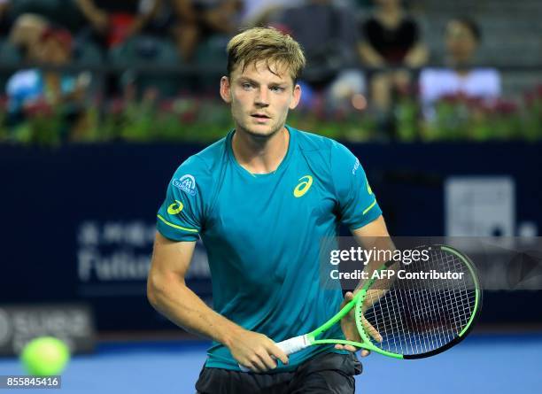 David Goffin of Belgium reacts while playing against Henri Laaksonen of Switzerland during their men's singles semi-final match at the ATP Shenzhen...