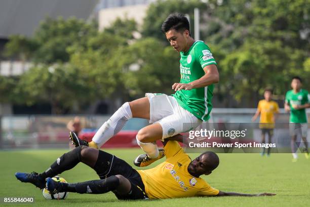 Chun Sing Yuen of Wofoo Tai Po fights for the ball with De Souza Dos Santos Jose Victor of Lee Man during the Hong Kong Premier League Week 4 match...