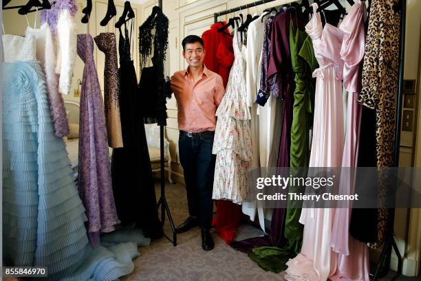 Thai fashion designer Ong-Oaj Pairam poses with his creations during a presentation as part of the Paris Fashion Week Womenswear Spring/Summer 2018...