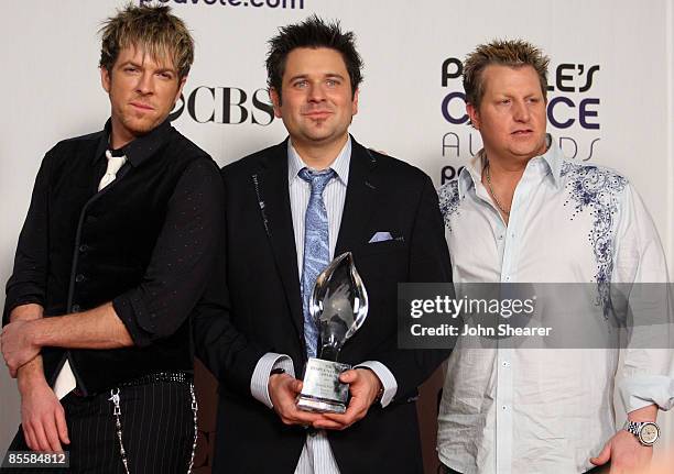 Musicians Joe Don Rooney, Jay DeMarcus and Gary LeVox of 'Rascal Flatts' pose in the press room at the 35th Annual People's Choice Awards held at the...