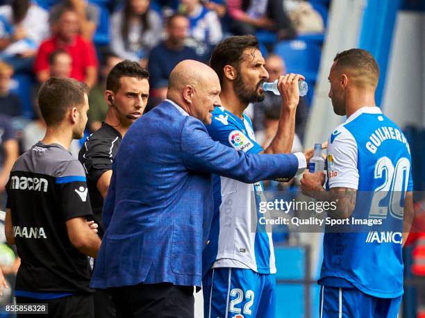 Pepe Mel the manager of Deportivo de La Coruna talks with Guilherme Dos Santos of Deportivo de La Coruna during the La Liga match between Deportivo...