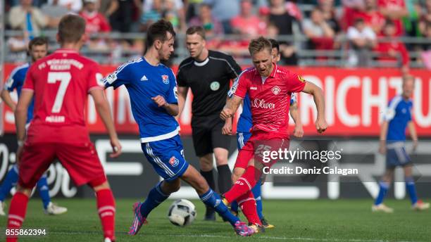 Orestis Kiomourtzoglou of Unterhaching challenges Bjoern Jopek of Wuerzburg during the 3. Liga match between FC Wuerzburger Kickers and SpVgg...