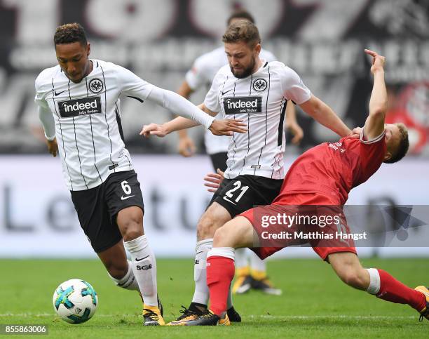 Jonathan de Guzman of Frankfurt, Marc Stendera of Frankfurt and Santiago Ascacibar of Stuttgart fight for the ball during the Bundesliga match...