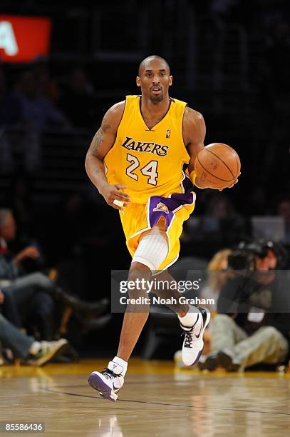 Kobe Bryant of the Los Angeles Lakers moves the ball up court during the game against the Golden State Warriors at Staples Center on March 19, 2009...