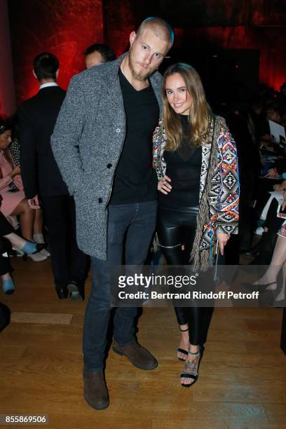 Actor Alexander Ludwig and Kristy Dawn Dinsmore attend the Elie Saab show as part of the Paris Fashion Week Womenswear Spring/Summer 2018 on...