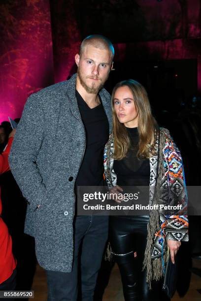 Actor Alexander Ludwig and Kristy Dawn Dinsmore attend the Elie Saab show as part of the Paris Fashion Week Womenswear Spring/Summer 2018 on...