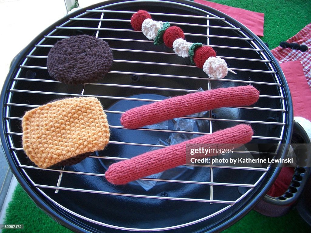 Knitted wool on barbecue grill