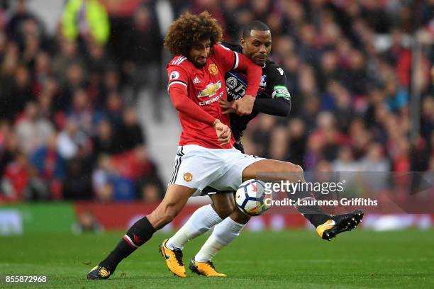 Marouane Fellaini of Manchester United controls the ball under pressure of Jason Puncheon of Crystal Palace during the Premier League match between...