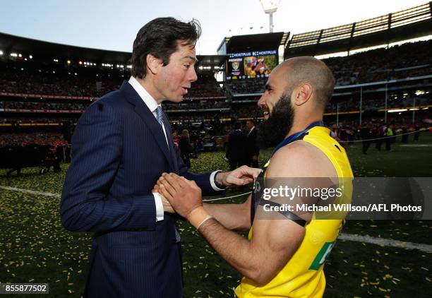 Gillon McLachlan, Chief Executive Officer of the AFL congratulates Bachar Houli of the Tigers during the 2017 Toyota AFL Grand Final match between...