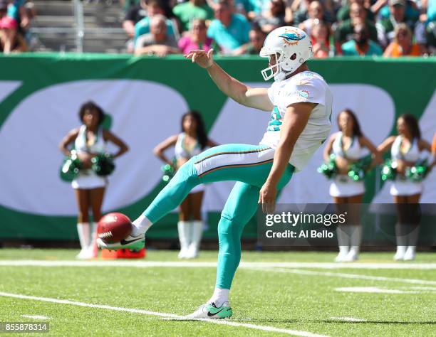 Matt Haack of the Miami Dolphins punts against the New York Jets during their game at MetLife Stadium on September 24, 2017 in East Rutherford, New...