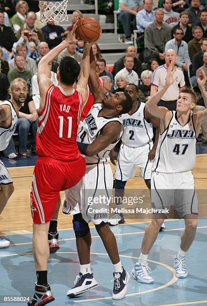 Paul Millsap of the Utah Jazz blocks Yao Ming of the Houston Rockets at EnergySolutions Arena on March 24, 2009 in Salt Lake City, Utah. NOTE TO...