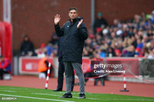 Mauricio Pellegrino, Manager of Southampton gives his team instructions during the Premier League match between Stoke City and Southampton at Bet365...