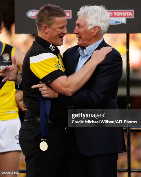 Damien Hardwick, Senior Coach of the Tigers is presented with the Jock McHale Medal by Mick Malthouse during the 2017 Toyota AFL Grand Final match...