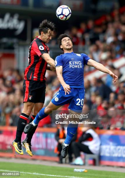 Shinji Okazaki of Leicester City and Charlie Daniels of AFC Bournemouth compete for the ball during the Premier League match between AFC Bournemouth...