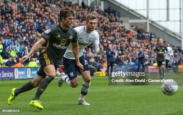 Preston North End's Tom Barkhuizen vies for possession with Sunderland's Adam Matthews during the Sky Bet Championship match between Preston North...