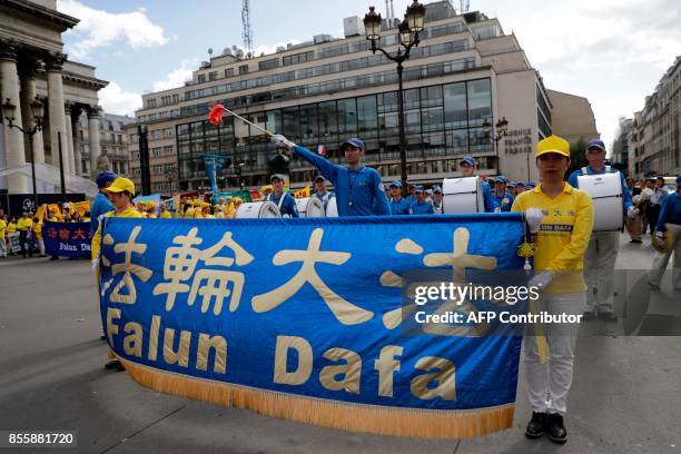 People demonstrate to support the practice of Falun Dafa in China , in Paris on September 30, 2017. China's officially atheist Communist authorities...