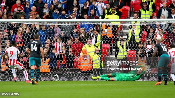 Fraser Forster of Southampton makes a save a penalty taken by Saido Berahino of Stoke City during the Premier League match between Stoke City and...